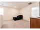 Upstairs loft area featuring a comfortable chaise lounge and neutral carpet at 9526 Granville Bridge St, Las Vegas, NV 89139