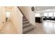Carpeted staircase with a view into the living room and adjacent spaces at 9526 Granville Bridge St, Las Vegas, NV 89139