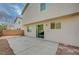 Large backyard with concrete patio, gravel landscaping, and rear exterior view of home at 9732 Kampsville Ave, Las Vegas, NV 89148