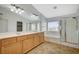 Bathroom with double sink vanity, soaking tub, and a glass-enclosed shower at 9732 Kampsville Ave, Las Vegas, NV 89148