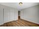 Bedroom with hardwood floors and closet space, ready to be personalized and enjoyed at 9732 Kampsville Ave, Las Vegas, NV 89148