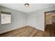 This is a simple bedroom with wood-look floors and closet at 9732 Kampsville Ave, Las Vegas, NV 89148