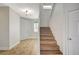 Foyer with stairs, neutral paint, tiled floors, and a front door to welcome guests at 9732 Kampsville Ave, Las Vegas, NV 89148