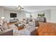 Virtually staged living room with plush seating, a cozy rug, and stylish decor creating an inviting space at 9732 Kampsville Ave, Las Vegas, NV 89148