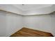 Spacious walk-in closet with built-in shelving and wood-look floors at 9732 Kampsville Ave, Las Vegas, NV 89148