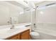 Bright bathroom features a tub-shower combo and large mirror above the sink at 9908 Camino Loma Verde Ave, Las Vegas, NV 89117