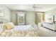 Bright bedroom with neutral walls, dual windows, and matching white furniture at 9908 Camino Loma Verde Ave, Las Vegas, NV 89117