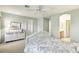 Bright bedroom featuring neutral walls, carpet, ceiling fan, and built in vanity at 9908 Camino Loma Verde Ave, Las Vegas, NV 89117