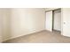 Empty bedroom with carpet and a closet with sliding doors at 9908 Camino Loma Verde Ave, Las Vegas, NV 89117