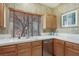 Bright kitchen featuring white countertops and light wood cabinetry at 9908 Camino Loma Verde Ave, Las Vegas, NV 89117