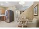 Eat-in kitchen area with stainless steel refrigerator and lots of natural light at 9908 Camino Loma Verde Ave, Las Vegas, NV 89117