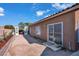 Backyard featuring a partially covered patio area and desert landscaping at 3792 Calle De Rio Ave, Las Vegas, NV 89115