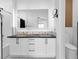 Modern bathroom features a double sink vanity with sleek fixtures and a large mirror at 3792 Calle De Rio Ave, Las Vegas, NV 89115