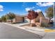 Single story home featuring a well-kept lawn, desert landscaping, and attached two car garage at 3792 Calle De Rio Ave, Las Vegas, NV 89115