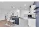 Bright open concept kitchen featuring a breakfast bar, ample lighting and modern appliances at 3792 Calle De Rio Ave, Las Vegas, NV 89115