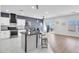Bright open concept kitchen features a breakfast bar, ample lighting and modern appliances at 3792 Calle De Rio Ave, Las Vegas, NV 89115