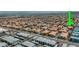 Expansive aerial view of a residential community in a suburban setting, marked with green arrow at 10001 Peace Way # 2269, Las Vegas, NV 89147