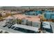 Wide aerial view of community featuring condos with red tile roofs, assigned covered parking, and desert landscaping at 10001 Peace Way # 2269, Las Vegas, NV 89147