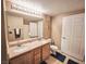 Bathroom featuring a double sink vanity and a full-sized mirror with overhead lighting at 10001 Peace Way # 2269, Las Vegas, NV 89147