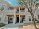 Inviting multi-story condo featuring a private balcony and well-maintained facade with nice front yard landscaping at 10001 Peace Way # 2269, Las Vegas, NV 89147