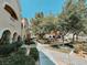 Lush landscaping and paved walkways enhance the community's curb appeal at 10001 Peace Way # 2269, Las Vegas, NV 89147