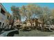 Well-maintained lawn and landscaping around buildings in a residential community at 10001 Peace Way # 2269, Las Vegas, NV 89147