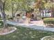 Outdoor grilling area featuring multiple grills, picnic tables, and well-maintained landscaping at 10001 Peace Way # 2269, Las Vegas, NV 89147
