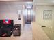 View of a hallway leading to the stairs, adjacent to the living room and featuring wall decorations at 10001 Peace Way # 2269, Las Vegas, NV 89147