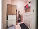 Practical laundry room with washer, dryer, and storage shelving, maximizing space efficiency at 10001 Peace Way # 2269, Las Vegas, NV 89147