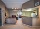 Inviting living room featuring neutral tones, plush carpeting, and access to the kitchen area at 10001 Peace Way # 2269, Las Vegas, NV 89147
