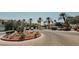 Community parking lot with lush landscaping, mature palm trees and well maintained landscaping at 10001 Peace Way # 2269, Las Vegas, NV 89147