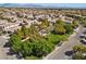 Beautiful aerial view of the community showcasing lush landscaping and a charming gazebo at 10505 Howling Coyote Ave, Las Vegas, NV 89135