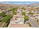 A residential neighborhood with mature trees and views of the mountains at 10505 Howling Coyote Ave, Las Vegas, NV 89135