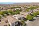 A quiet residential neighborhood featuring well-maintained homes and lush green trees at 10505 Howling Coyote Ave, Las Vegas, NV 89135