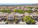 A beautiful neighborhood featuring well-manicured lawns, mature trees, and attractive single-Gathering homes at 10505 Howling Coyote Ave, Las Vegas, NV 89135