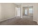 Bedroom featuring neutral walls, carpet flooring, and ample closet space at 10505 Howling Coyote Ave, Las Vegas, NV 89135