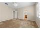 Cozy bedroom with neutral carpet, ceiling fan, and ensuite bathroom access at 10505 Howling Coyote Ave, Las Vegas, NV 89135