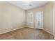 Neutral bedroom with carpet flooring, baseboards, a window and closet at 10505 Howling Coyote Ave, Las Vegas, NV 89135