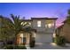 Charming two-story home with a well-manicured lawn and a desert-friendly landscape at 10505 Howling Coyote Ave, Las Vegas, NV 89135