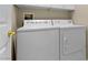 Convenient laundry room featuring a washer and dryer for easy chore completion at 10505 Howling Coyote Ave, Las Vegas, NV 89135