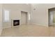 Inviting living area with tile floors and a fireplace for a cozy atmosphere at 10505 Howling Coyote Ave, Las Vegas, NV 89135