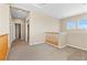Bright loft area featuring neutral walls, carpet flooring and natural lighting throughout the space at 10505 Howling Coyote Ave, Las Vegas, NV 89135