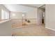 Bright loft with neutral walls, carpet flooring, and wood railing at 10505 Howling Coyote Ave, Las Vegas, NV 89135