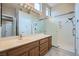 Bathroom with a shower and vanity with lots of light offers a clean and functional space for personal care routines at 10800 Brinkwood Ave, Las Vegas, NV 89134