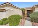 Charming house featuring desert landscaping and a covered entryway at 10800 Brinkwood Ave, Las Vegas, NV 89134