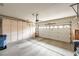 Spacious garage with ample storage cabinets, and automatic door at 10800 Brinkwood Ave, Las Vegas, NV 89134