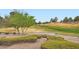 Beautiful golf course with green grass and landscaping at 10800 Brinkwood Ave, Las Vegas, NV 89134