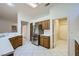 Modern kitchen boasts stainless steel appliances, wood cabinets, and ample counter space at 10800 Brinkwood Ave, Las Vegas, NV 89134