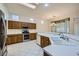 Bright kitchen features wood cabinets, and stainless steel appliances at 10800 Brinkwood Ave, Las Vegas, NV 89134