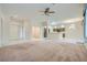 Inviting living room with open view to the kitchen and carpet flooring at 10800 Brinkwood Ave, Las Vegas, NV 89134